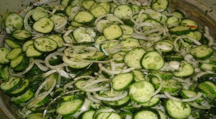 Step-by-step recipe with photos of pickled cucumbers with dill and garlic for the winter at home